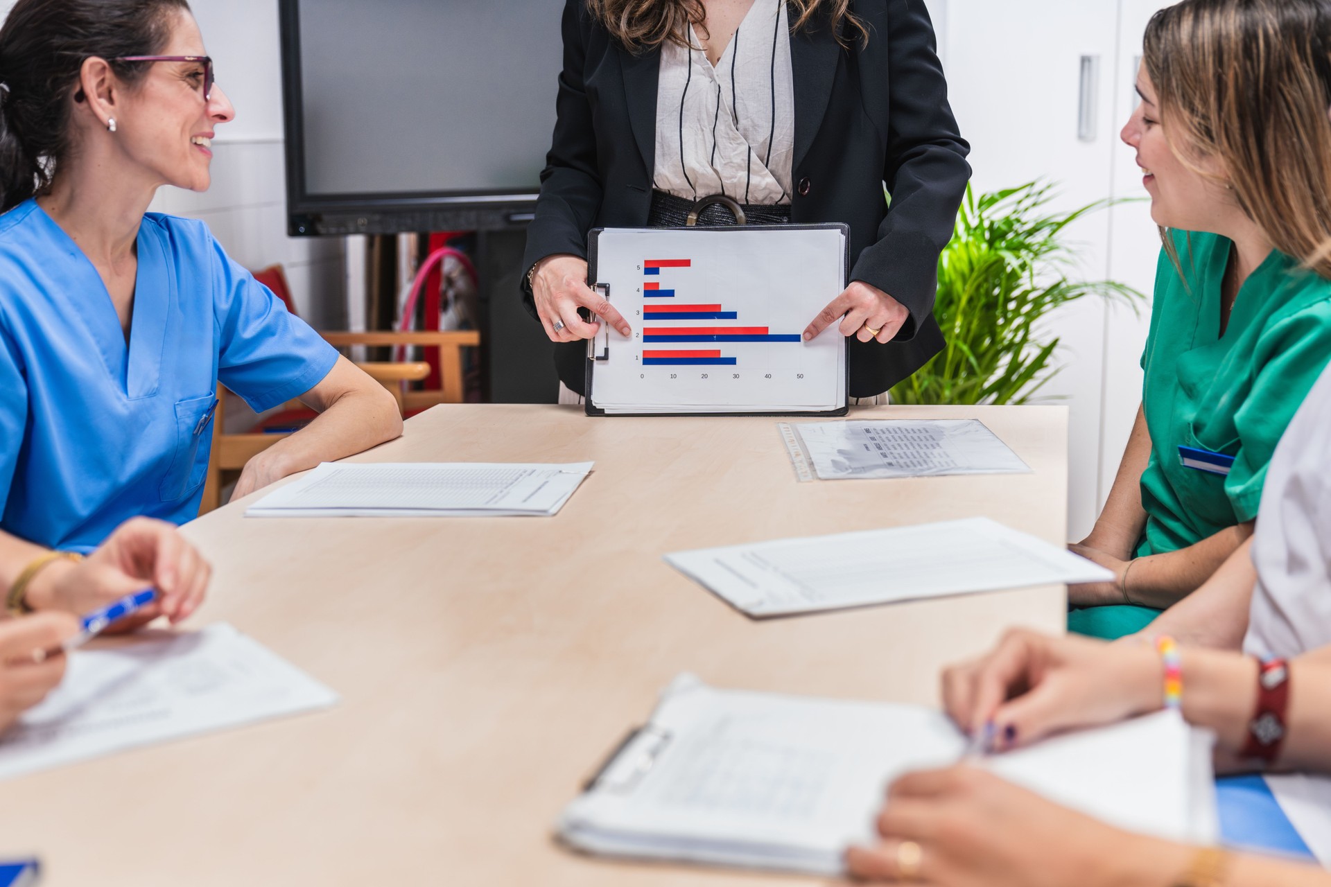 Healthcare professionals analyzing data in meeting